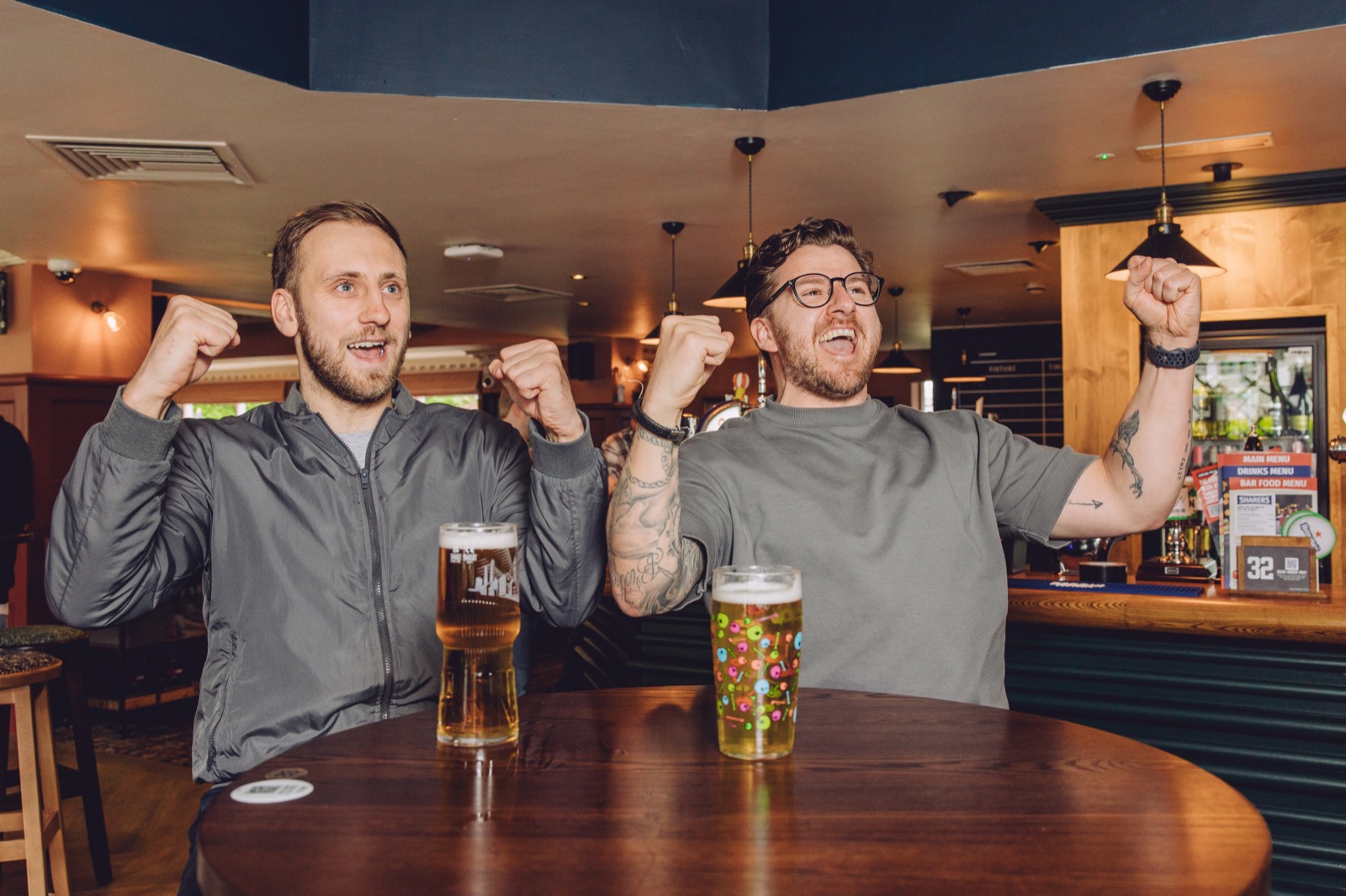Guests celebrating at a Grandstand pub table