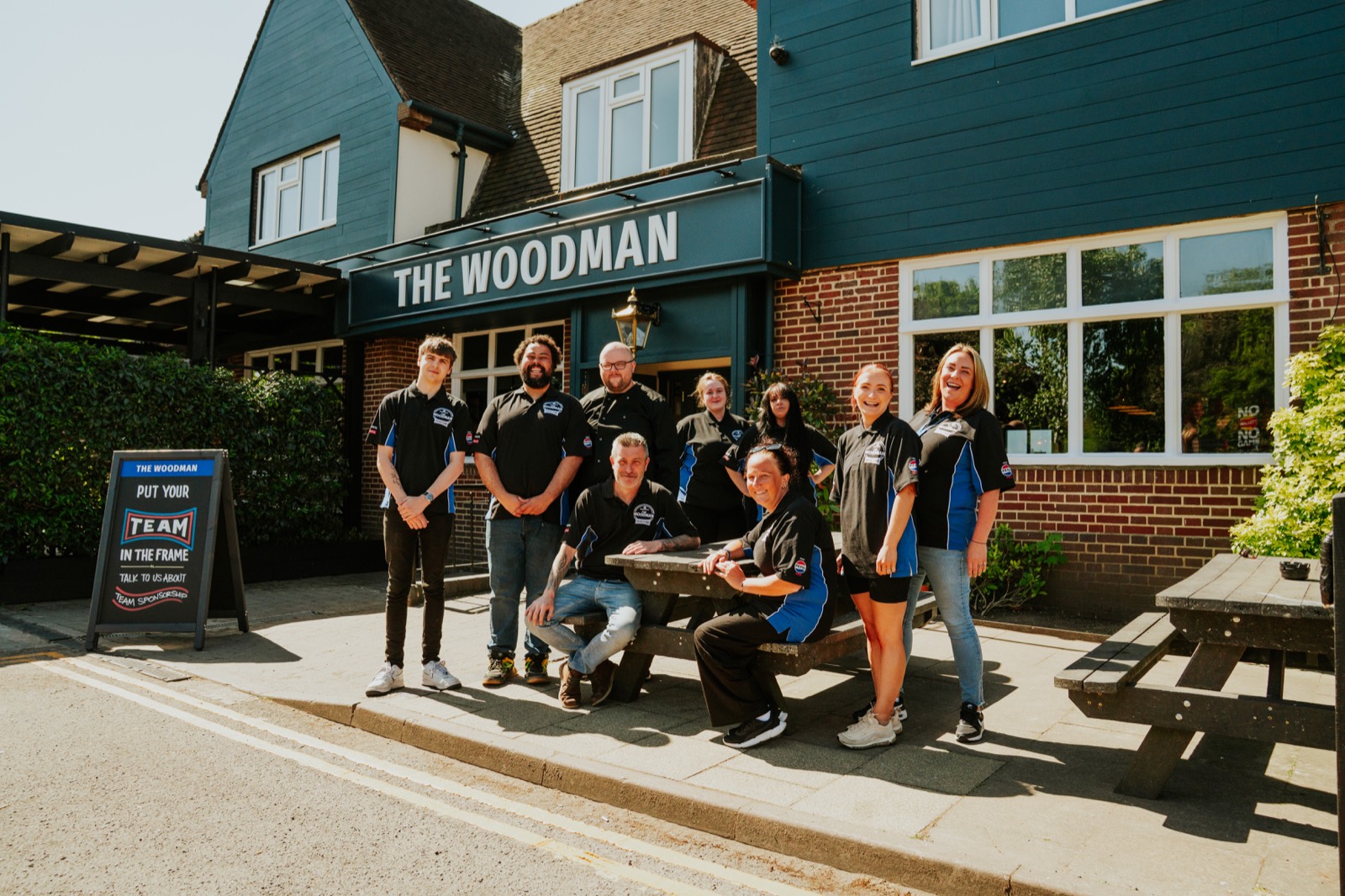 Grandstand team outside a pub exterior